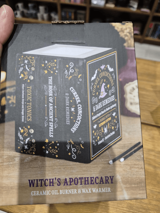 Wax Melt Burner – Black Book of Spells by Merch — book cover