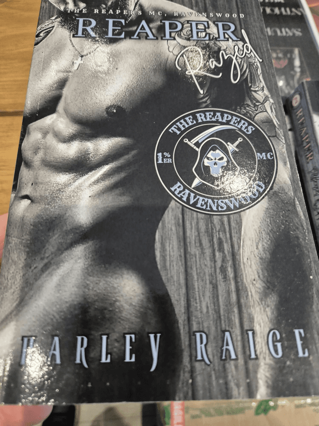 Reapers Razed by Harley Raige — book cover