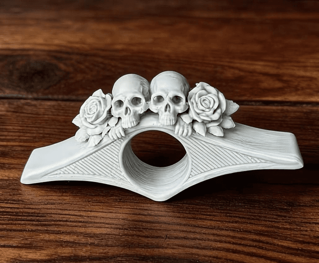 3D Printed Skull Thumb Page Holder by Merch — book cover