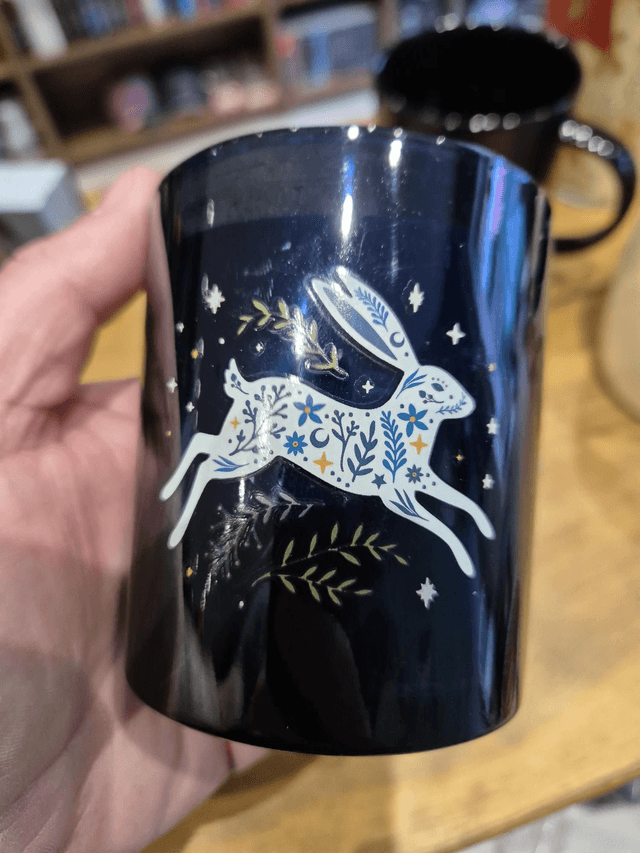 Leaping Hare Blue Candle by Merch — book cover
