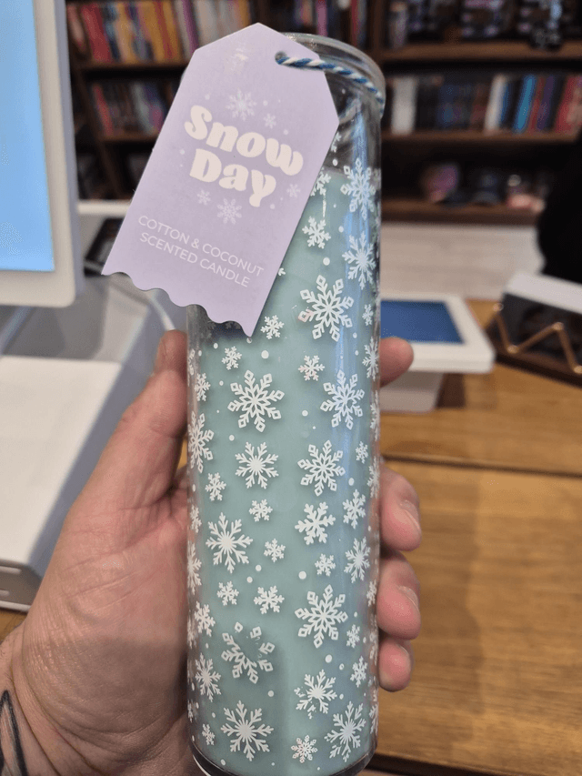 Snowy Day Pillar Candle by Merch — book cover