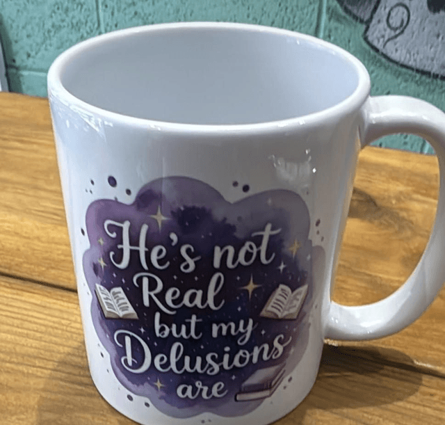 Mug – He Is Not Real by Merch — book cover