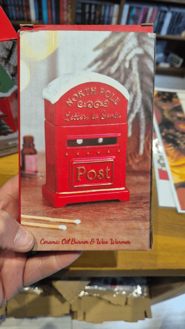 Christmas North Pole Oil Burner by Merch — book cover